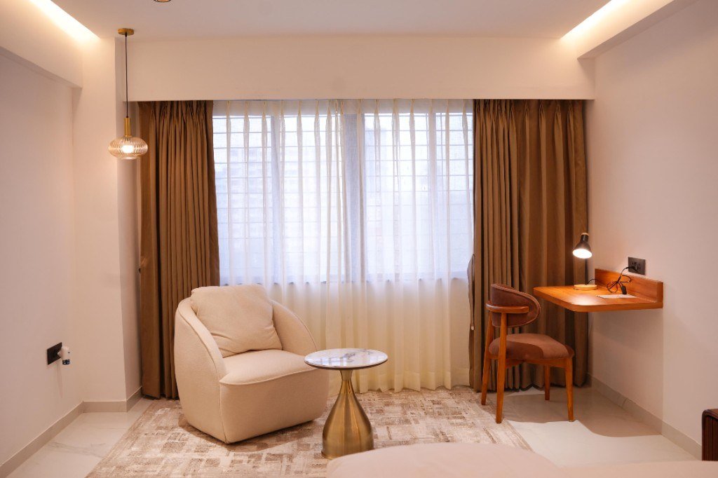 Seating and desk in the Deluxe AC Room